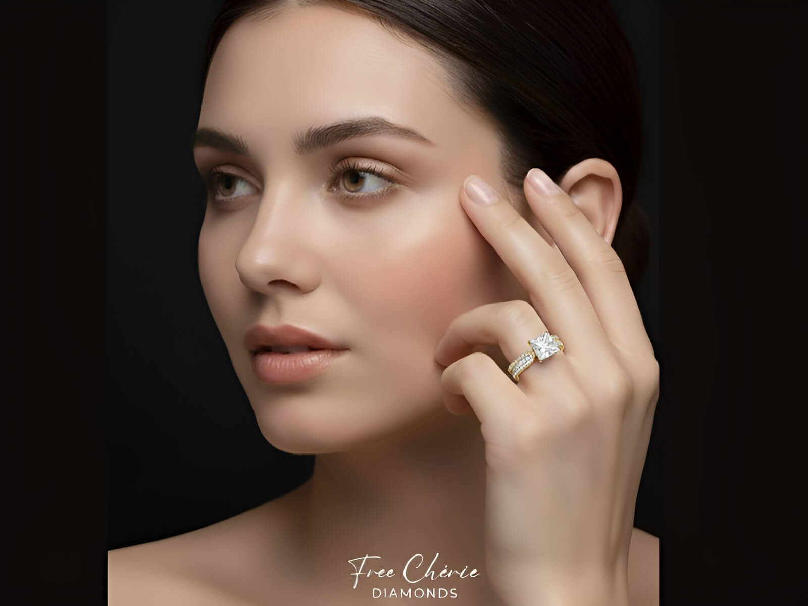 Woman wearing a diamond ring on a dark background with 'Free Cherie Diamonds' branding.